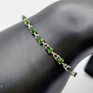 Elegant Silver Bracelet with Vibrant Green Stones
